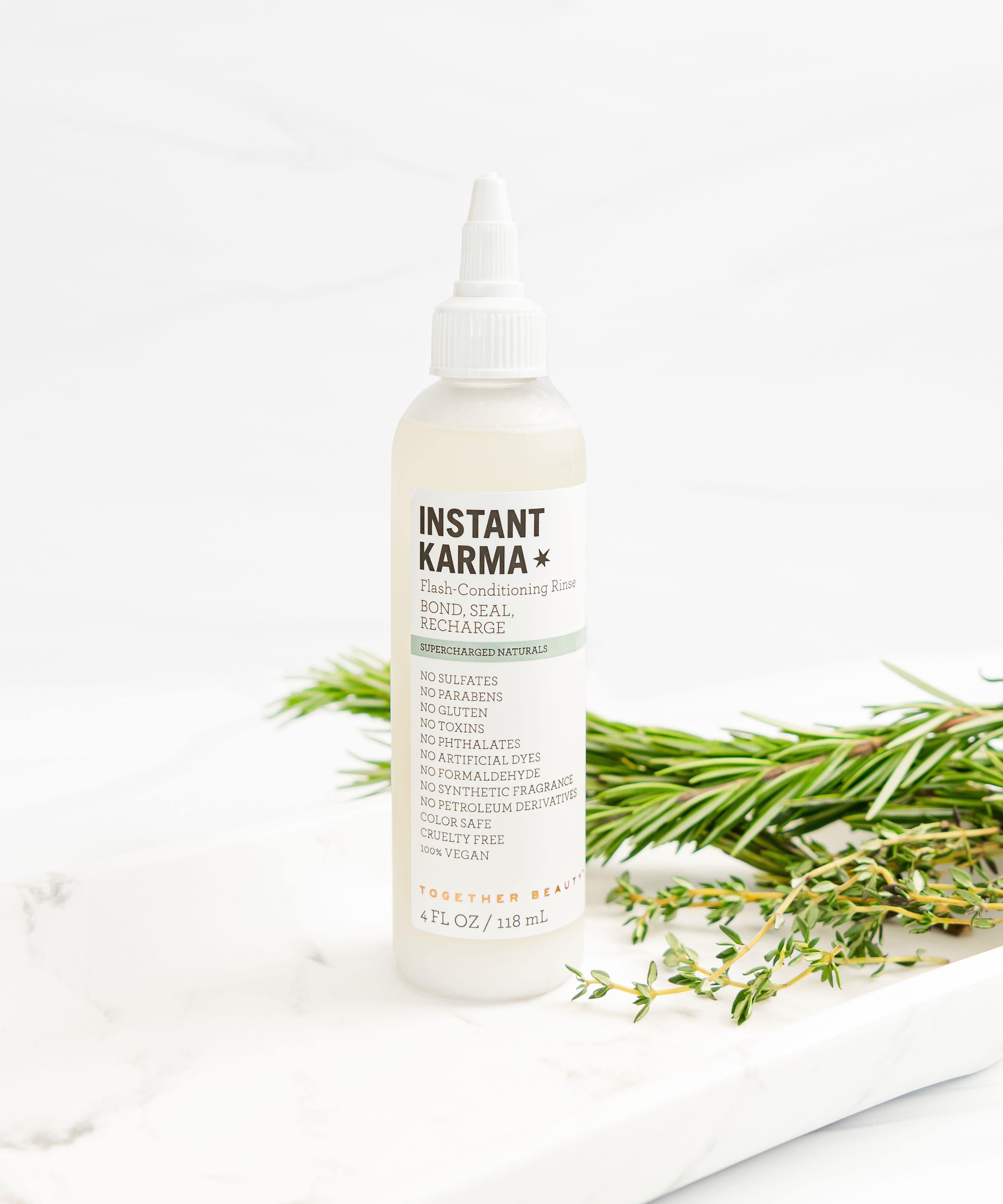 Instant Karma flash conditioning rinse that bonds, seals, and recharges hair.