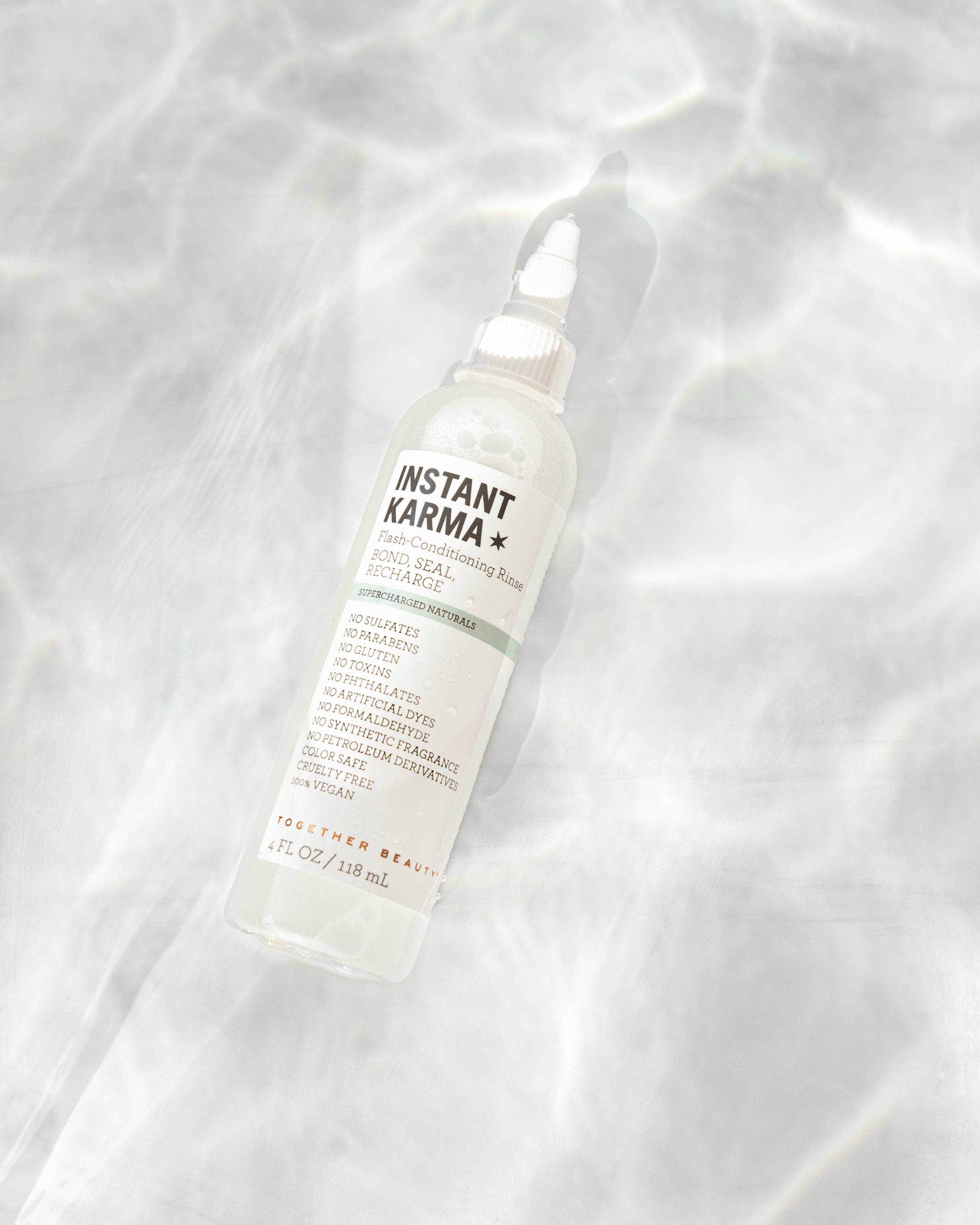 Instant Karma flash conditioning rinse that bonds, seals, and recharges hair.